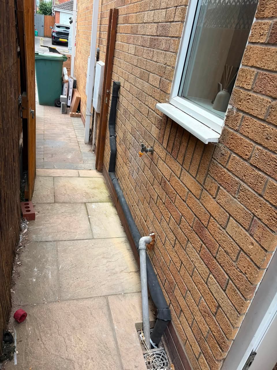 A new condensate pipe in 42mm, lagged, running down the outside wall to the gully.